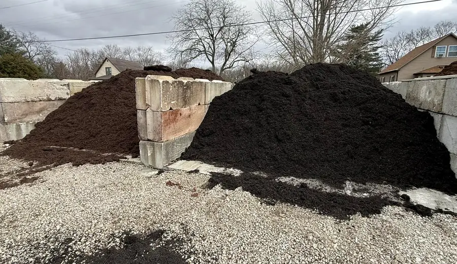 Bulk mulch stockpile in a concrete bay