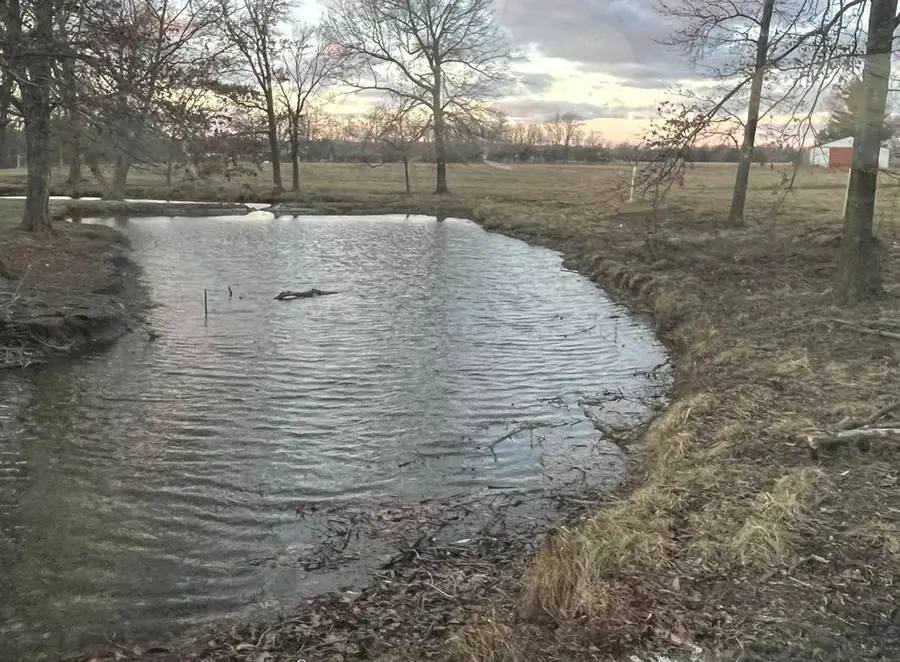 Excavated pond holding water