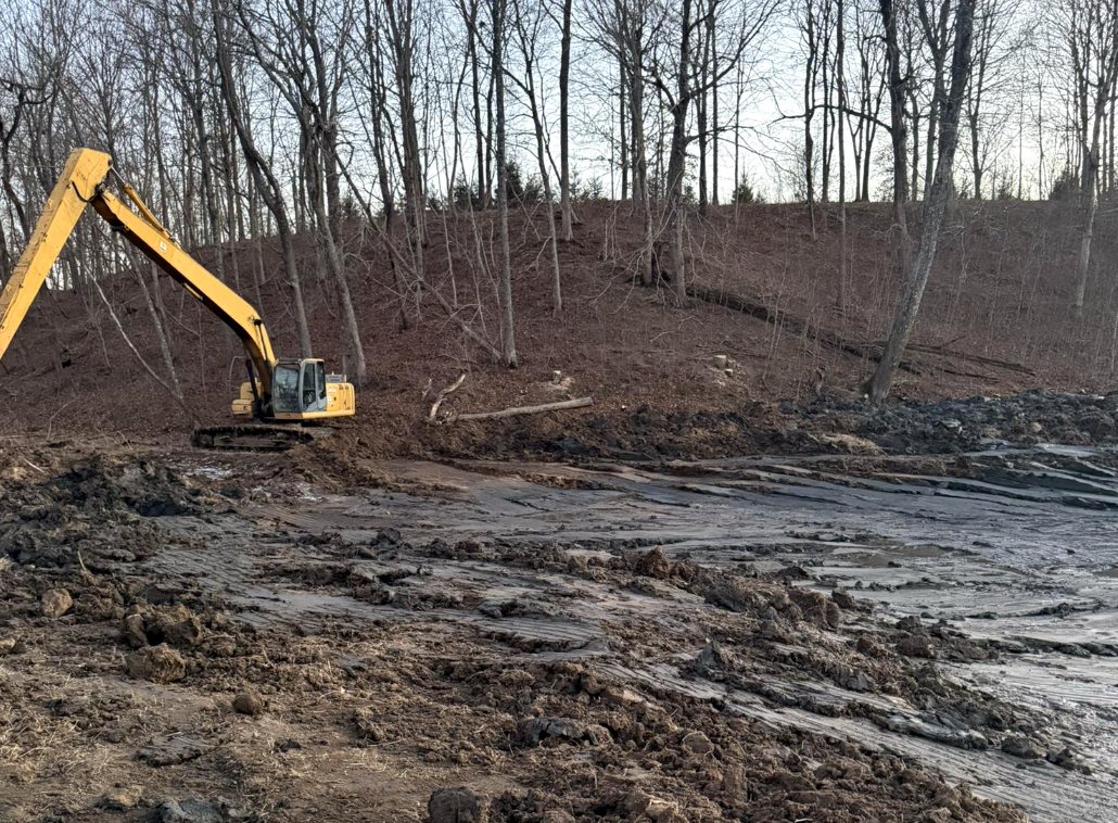 Excavator cutting a hillside
