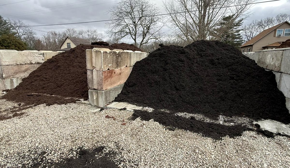 Bulk mulch stockpile in a concrete bay